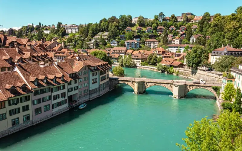 A view of a river passing through Bern with houses along the side